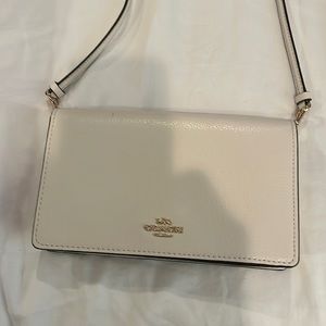 Never used. Coach crossbody bag.